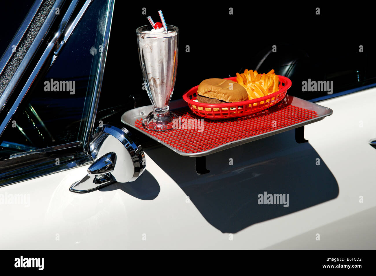 Drive-in restaurant tray attached to a 1965 Pontiac at a Classic Car Show in Belvidere, New Jersey, USA Stock Photo