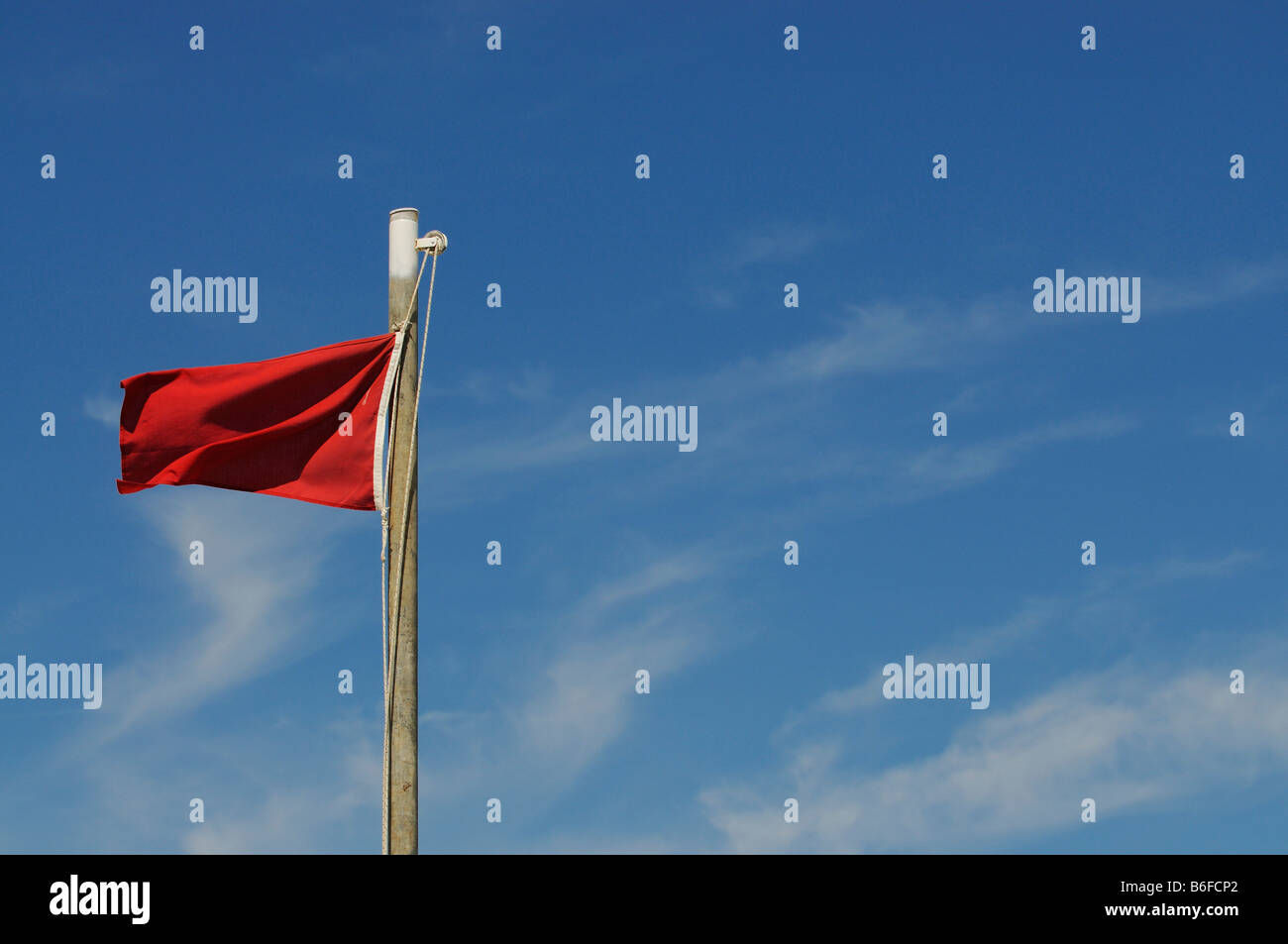 Red flag, swimming warning on the beach of Pineto, Abruzzi, Italy, Europe Stock Photo