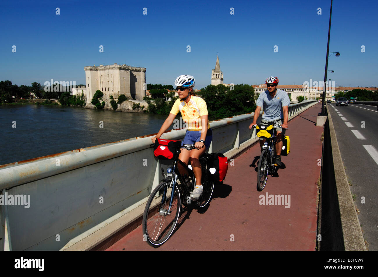 Bicyclists on the Rhône bridge near Tarascon, Provence, France, Europe Stock Photo