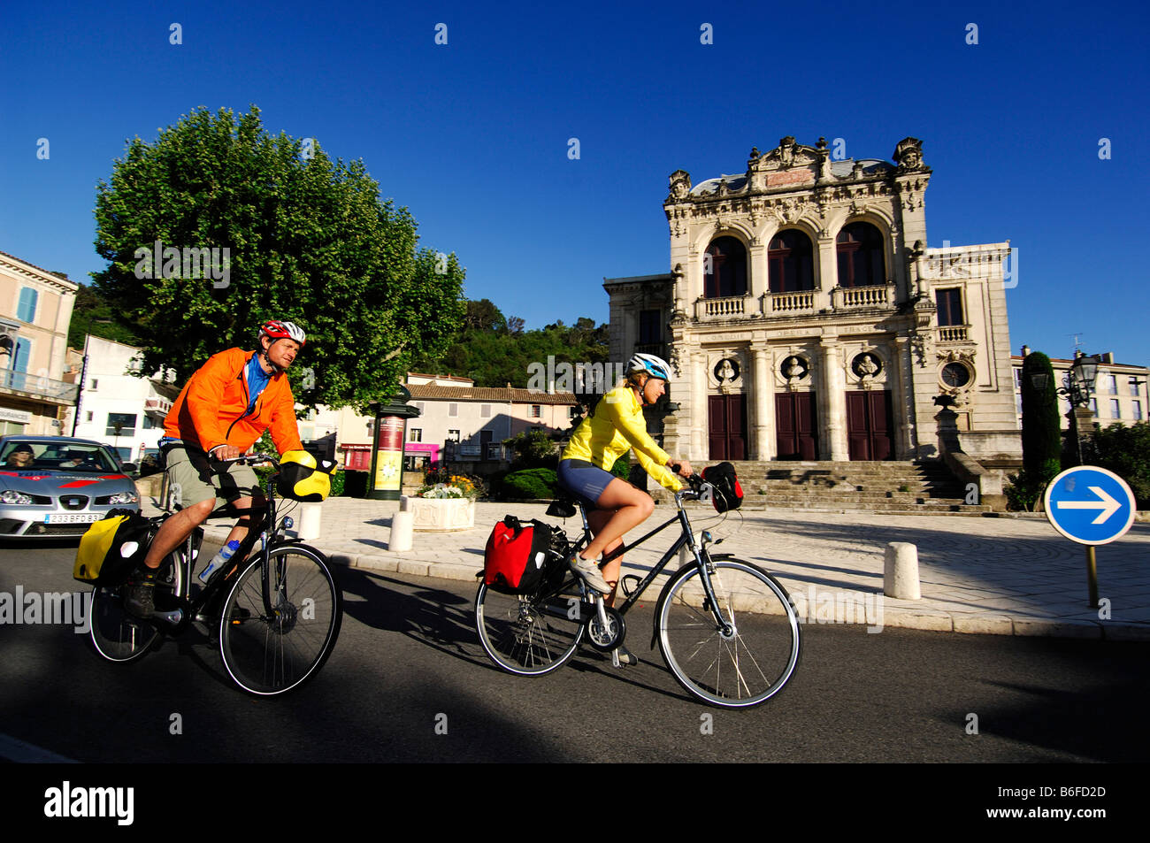 Cyclists in front of a theater in Orange, Provence, France, Europe Stock Photo