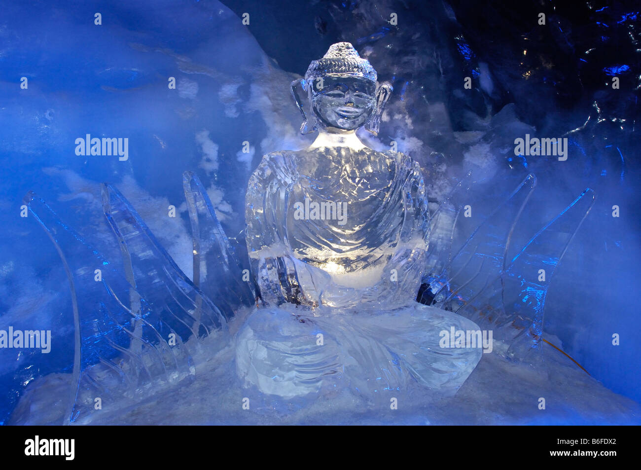 Ice Buddha statue in an ice cave in the Gletscherpalast or Glacier Palace, Klein Matterhorn Mountain, Zermatt, Valais or Wallis Stock Photo