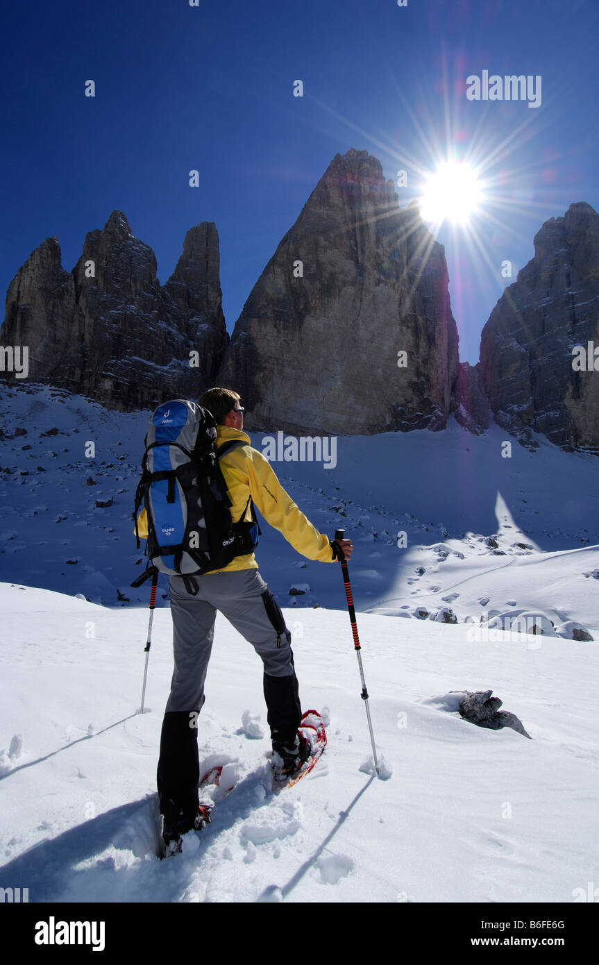 Snowshoeing in front of the mountain Drie Zinnen or Tre Cime di Lavaredo, Italian for Three Peaks of Lavaredo, Hochpustertal Va Stock Photo