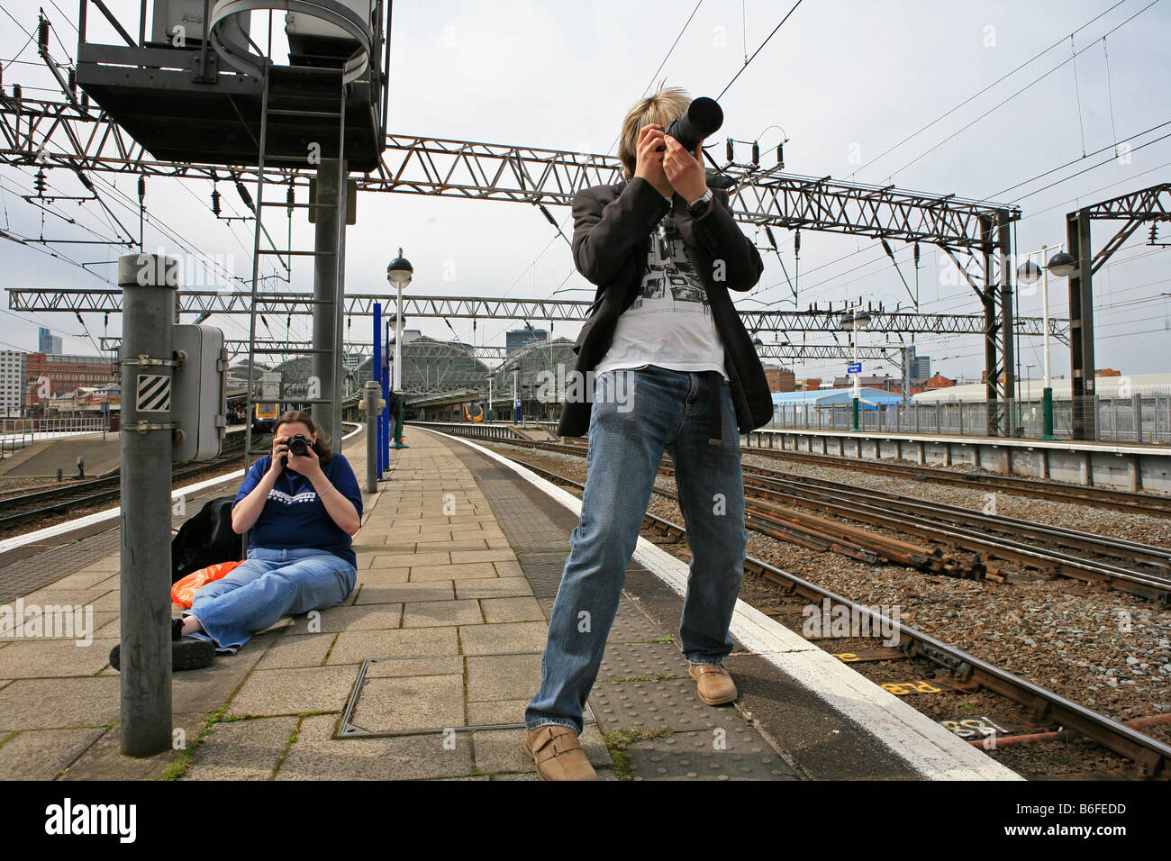 Alex and Louise are trainspotting in Manchester Piccadilly train