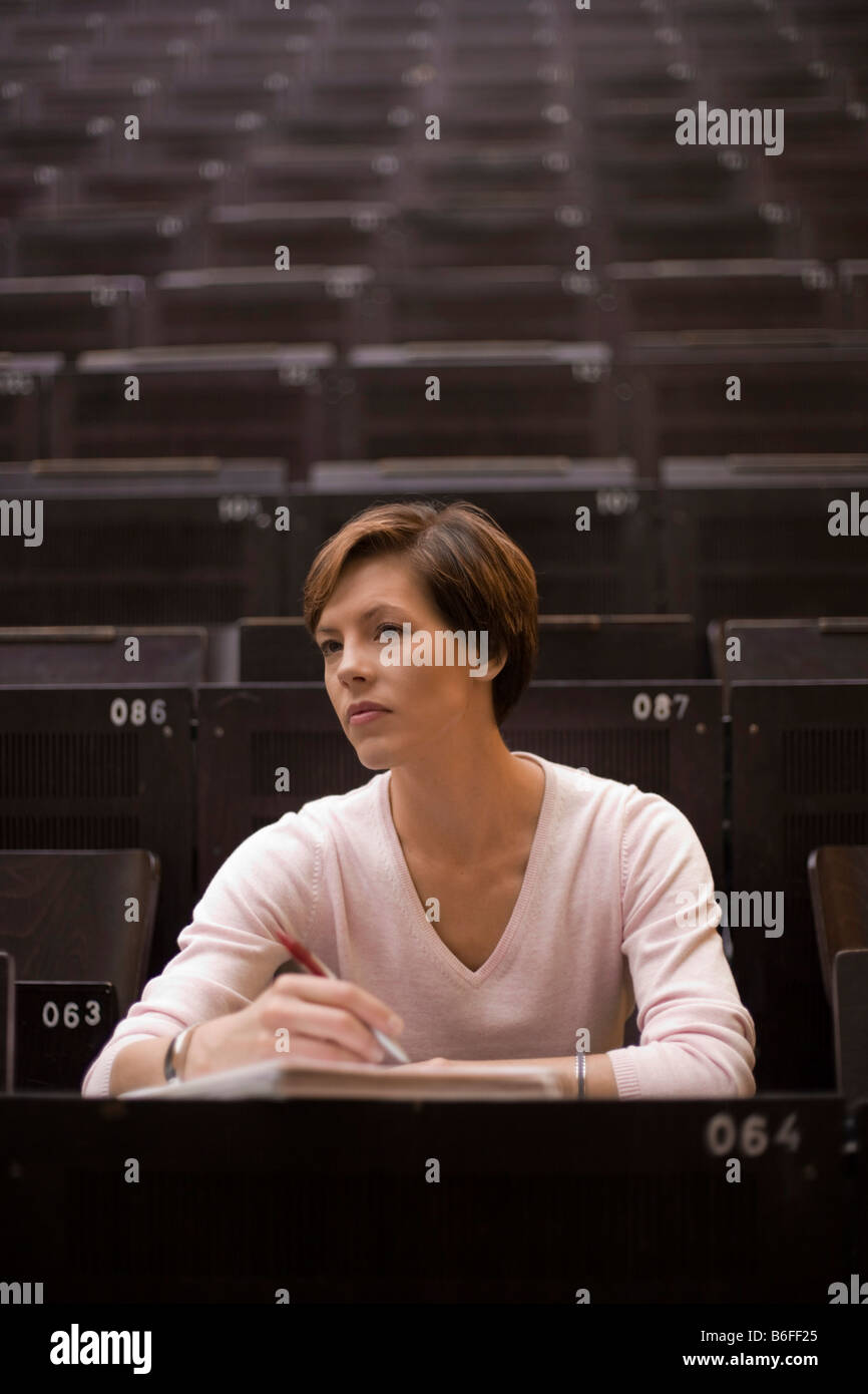 Female student in the lecture hall Stock Photo