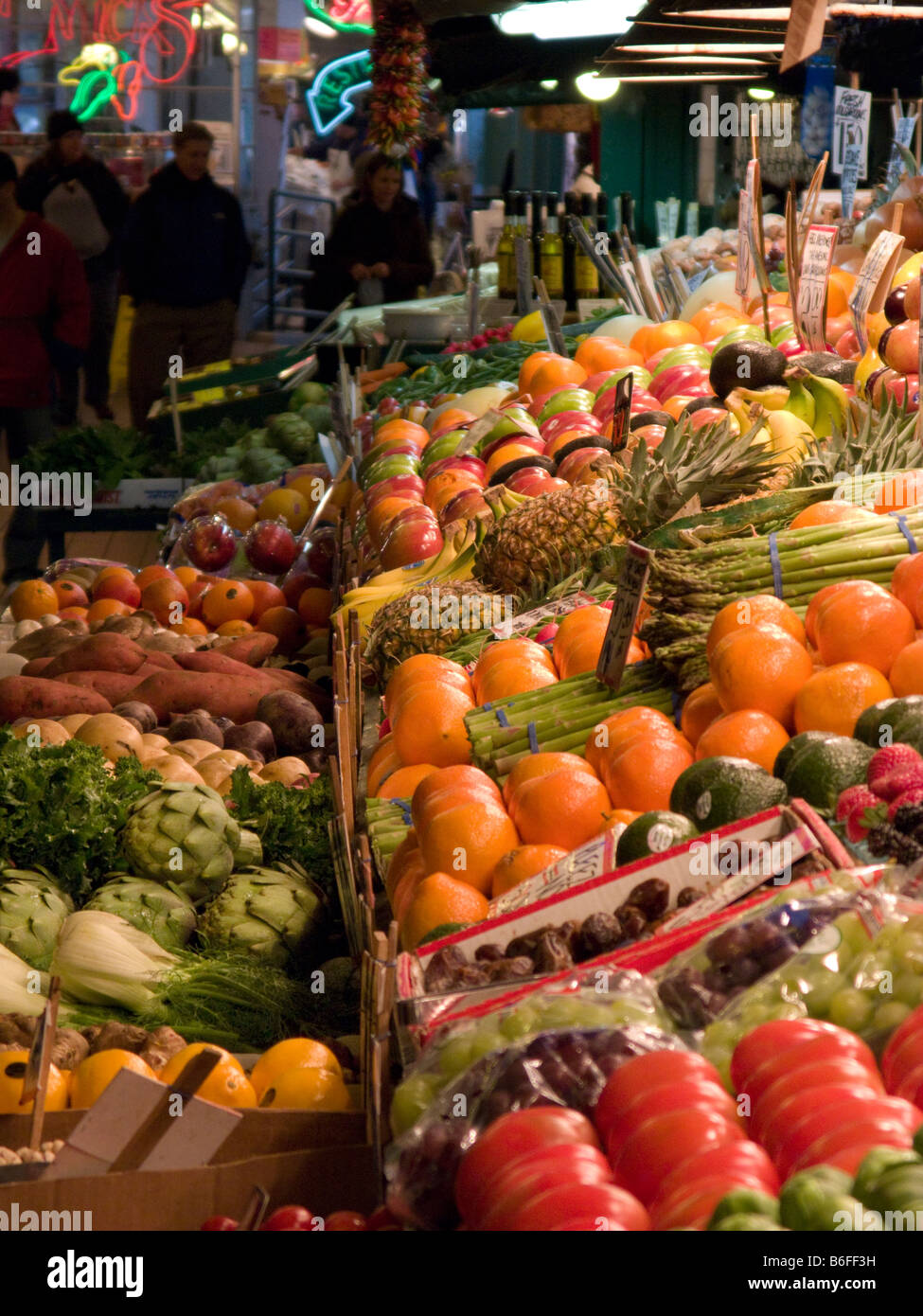 Produce stand with shoppers in background at famous Pike Place Market