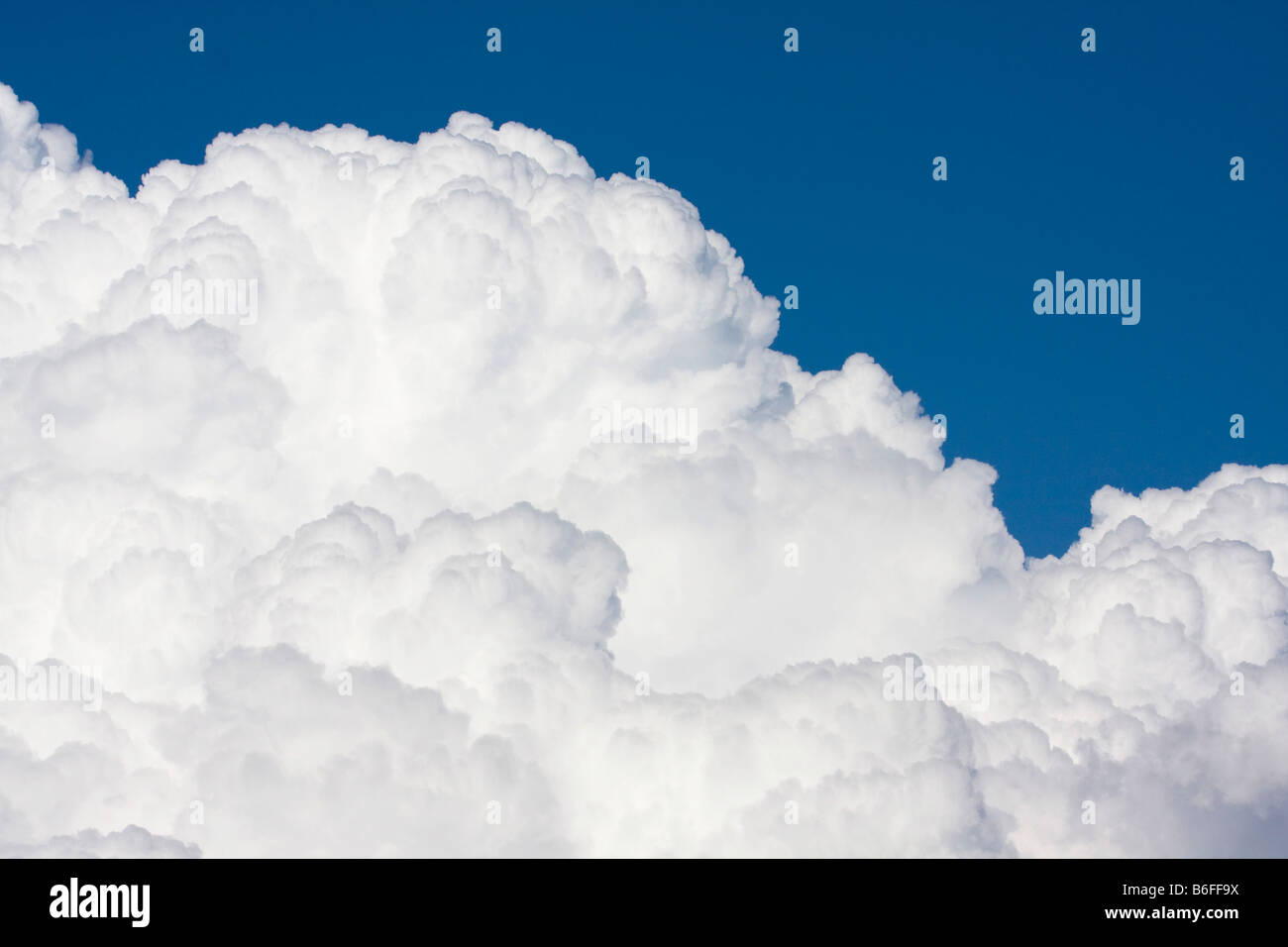 White cumulus clouds against blue sky Stock Photo