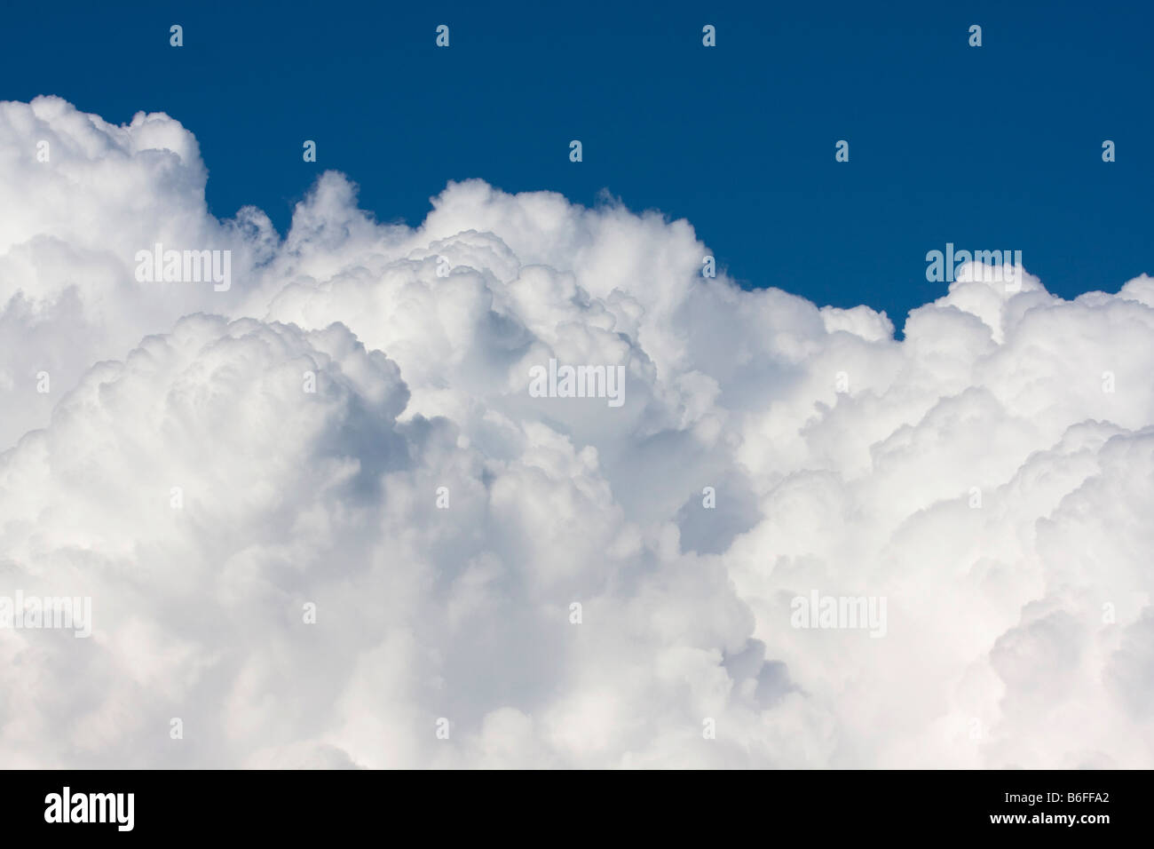 Whie cumulus clouds against blue sky Stock Photo