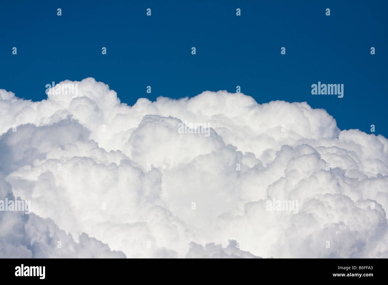 White cumulus clouds against blue sky Stock Photo