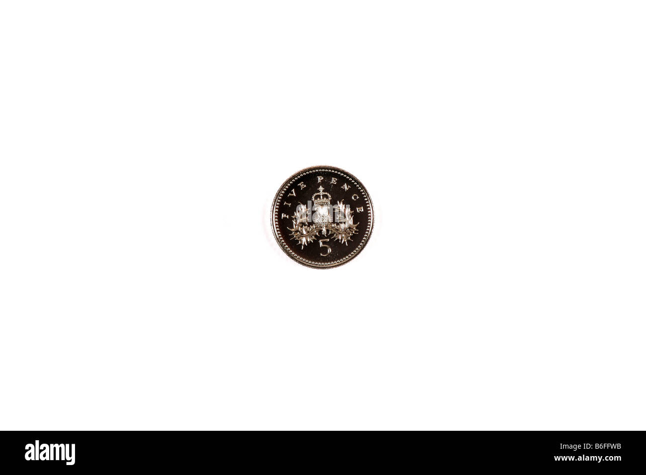 A photograph of a British five pence piece coin on a white background ...