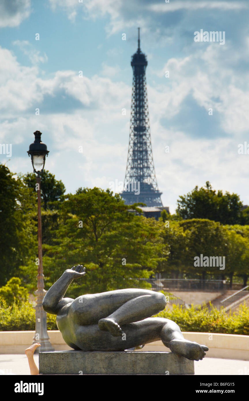 Lying statue in front of the Eiffel Tower in the Louvre Park, Paris, France, Europe Stock Photo