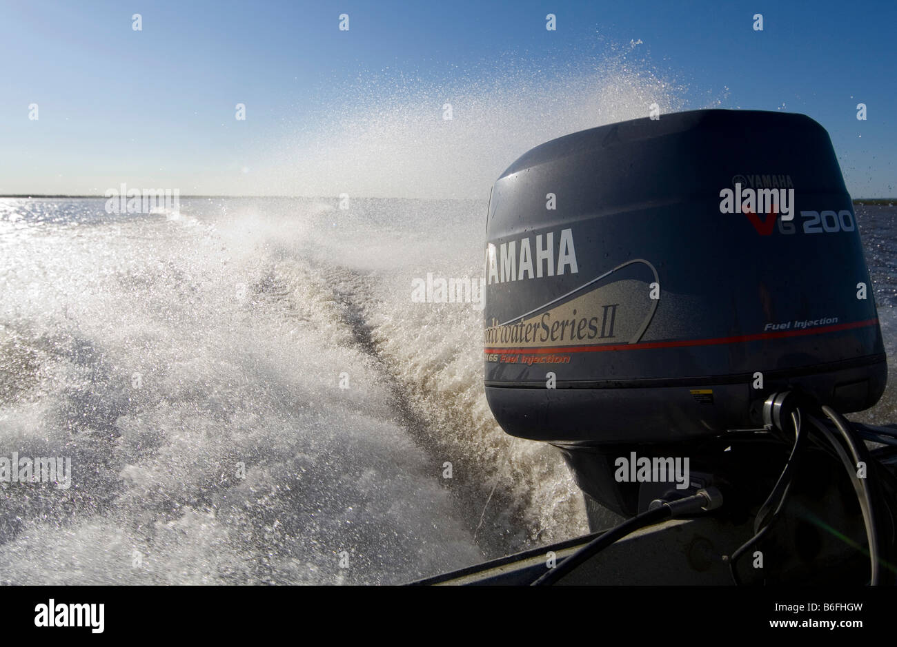 Yamaha motor on a boat, spraying water, Mackenzie River Delta, Northwest Territories, Canada, North America Stock Photo