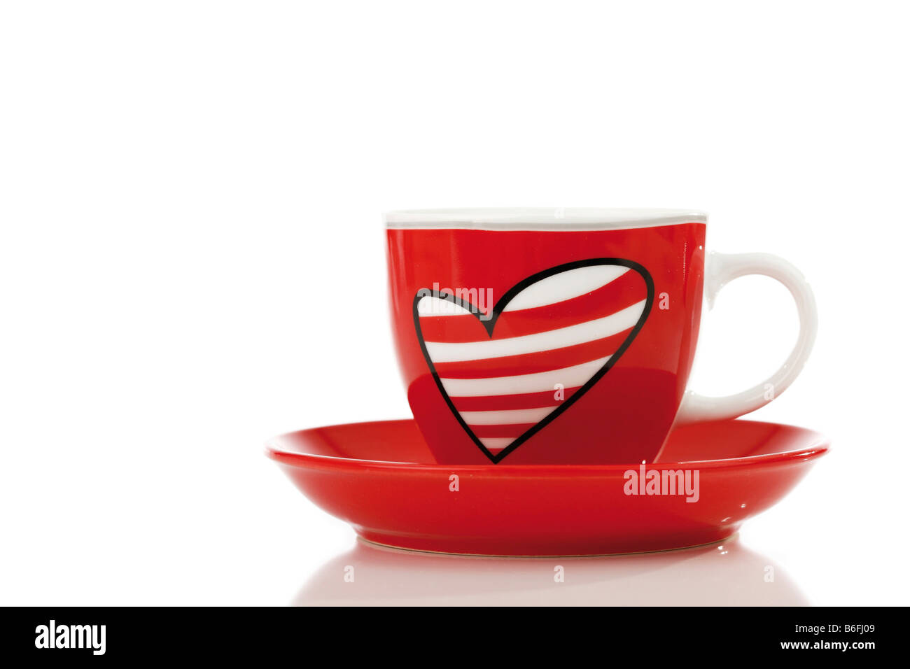 Cup and saucer with painted heart Stock Photo
