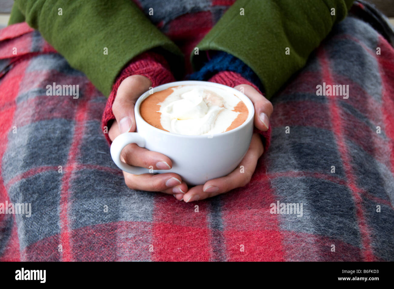 Hands holding cup of hot chocolate Stock Photo