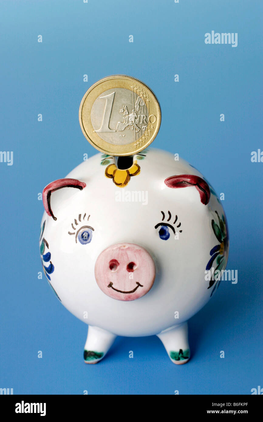 One Euro and piggy bank Stock Photo