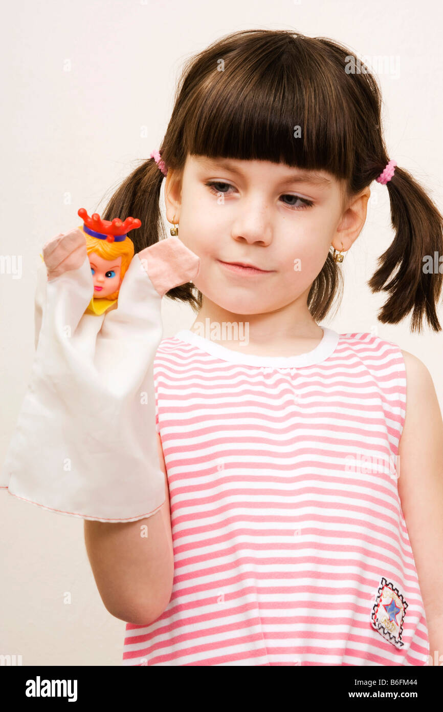 Little girl, 6 years, with puppet Stock Photo