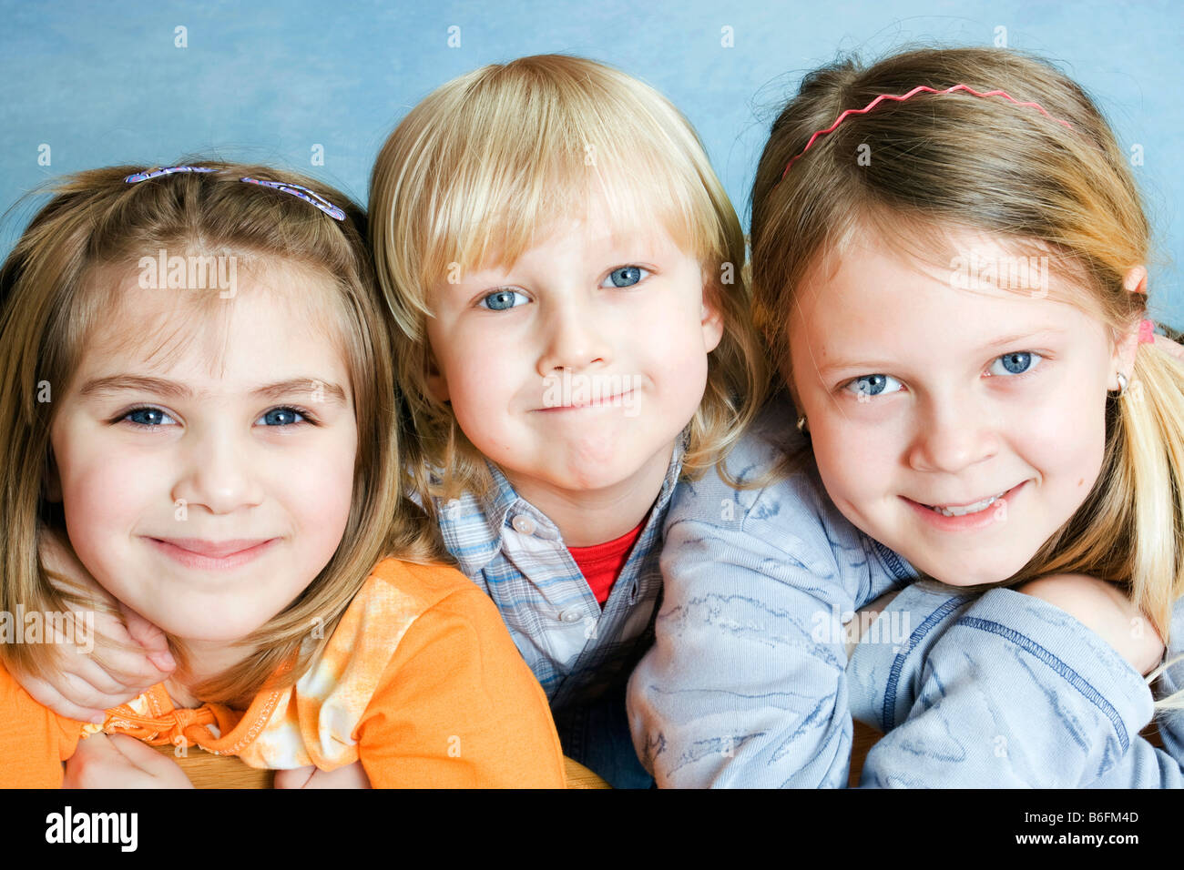 Three children, 6, 4 and 11 years Stock Photo