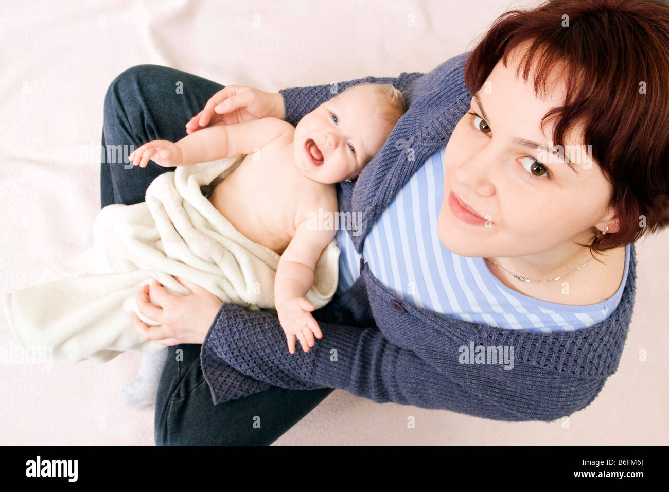 Baby, 7 months, with mother, 28 years Stock Photo