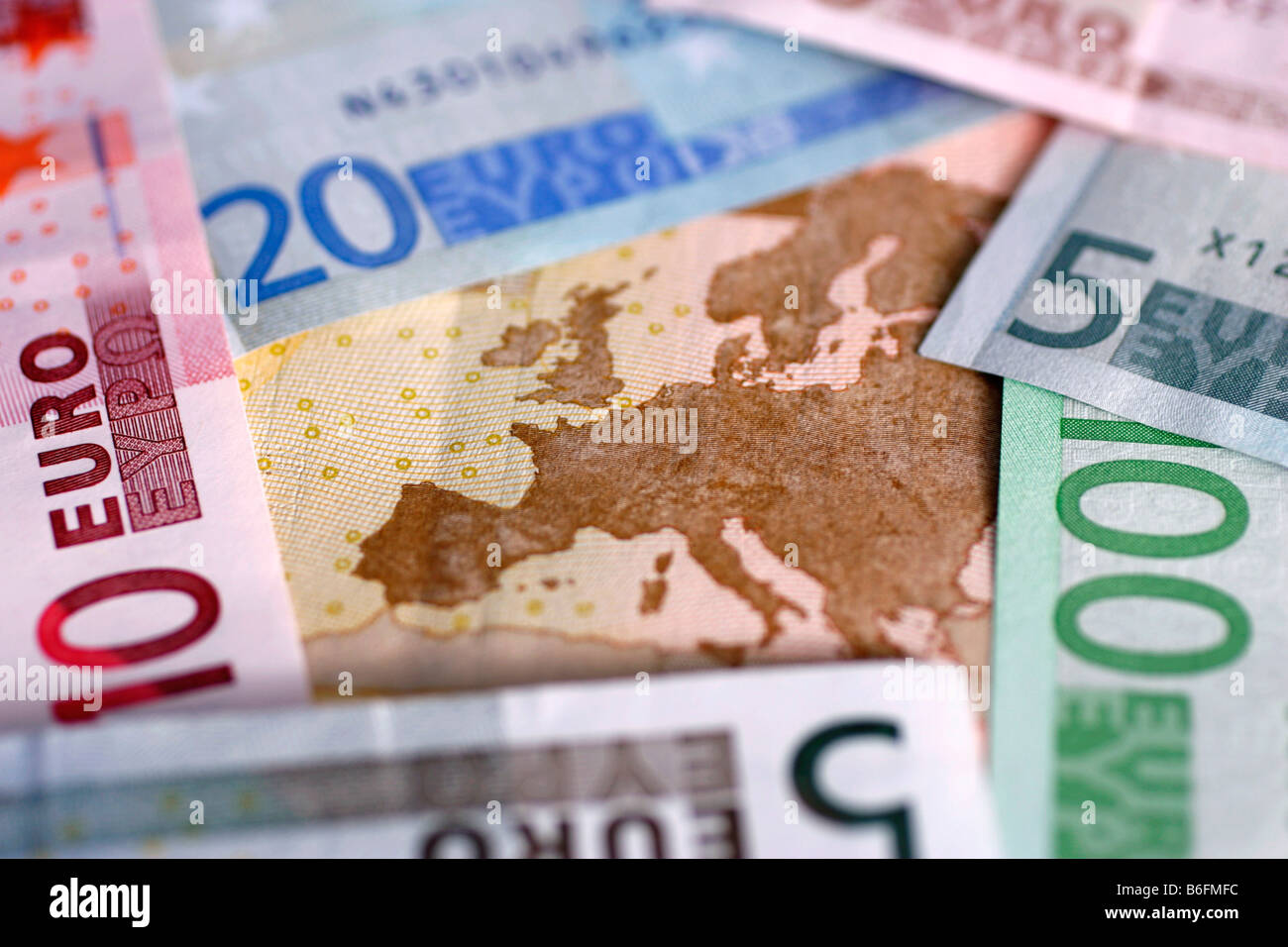 Euro-bills and coins Stock Photo