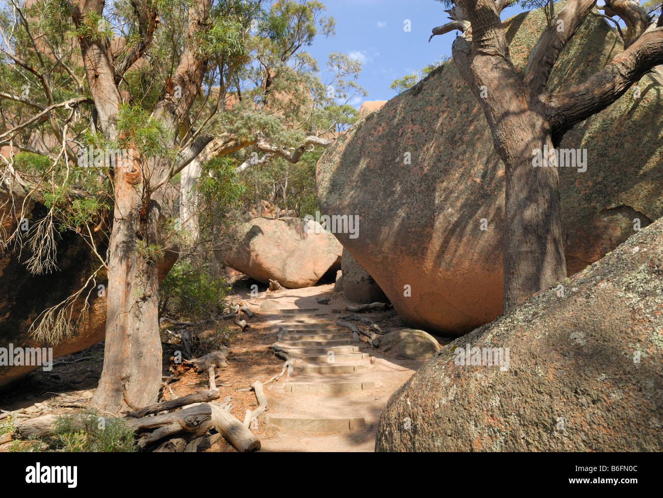Hiking between large granite boulders to the Hazards, Freycinet Peninsula, Tasmania, Australia Stock Photo