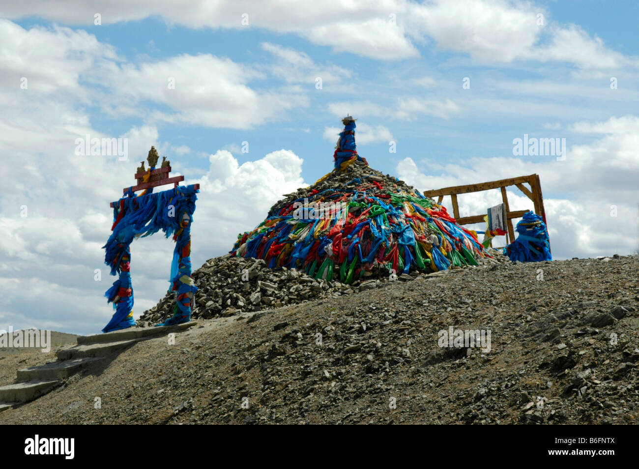 Rock pile, Ovoo, with coloured flags, Mongolia, Asia Stock Photo