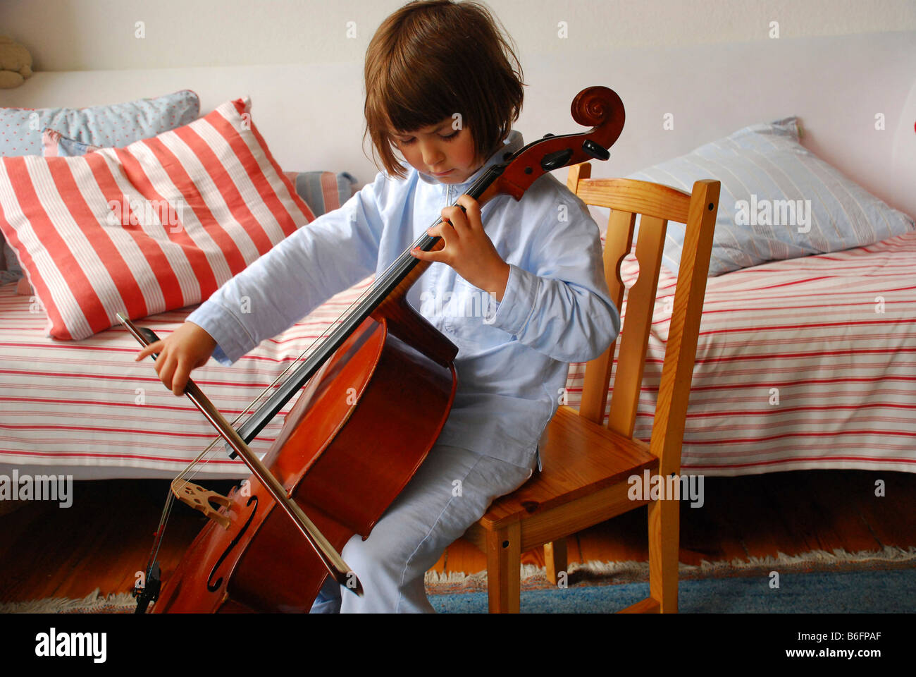 Young girl playing the cello Stock Photo