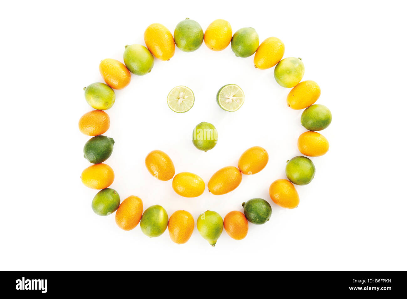 Kumquats or Cumquats (Fortunella) and Limequat (Citrus x floridana), as smiley face Stock Photo