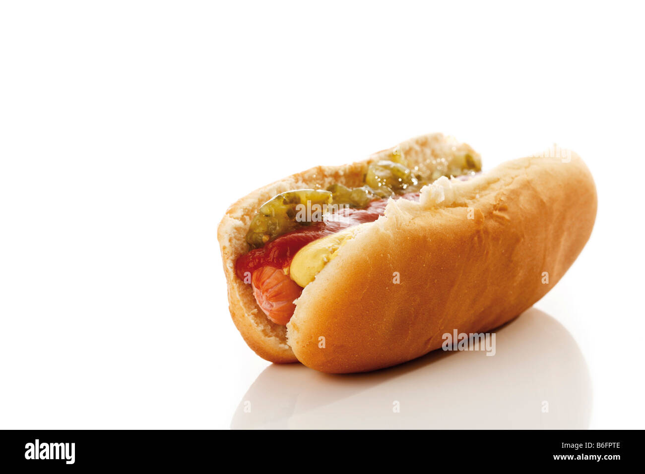 Hot dog, sausage in a bun with mustard, ketchup, relish Stock Photo