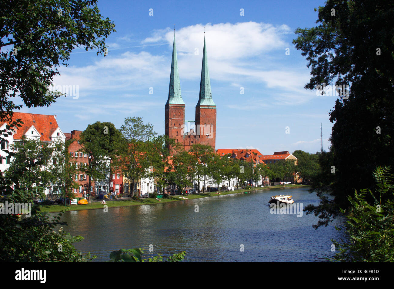 Luebeck cathedral, cathedral in the old hanseatic city of Luebeck and the Trave river and An der Obertrave street in front, Lue Stock Photo