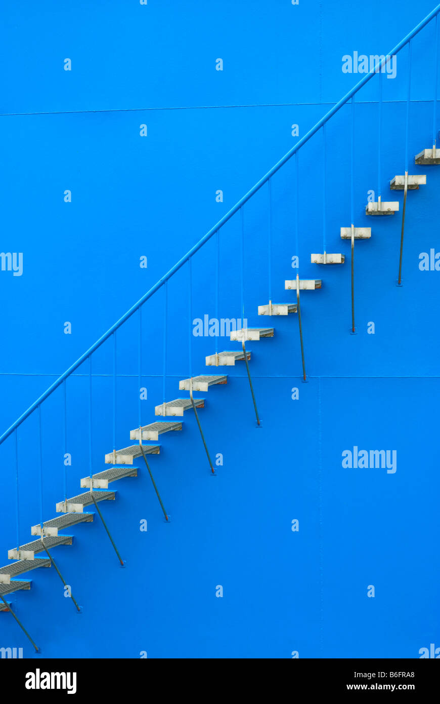Steel staircase on the outer wall of an oil tank Stock Photo
