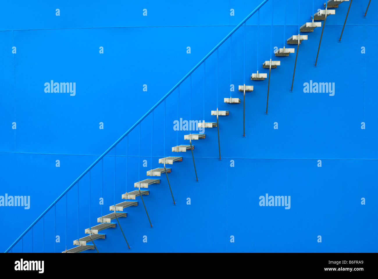 Steel staircase on the outer wall of an oil tank Stock Photo