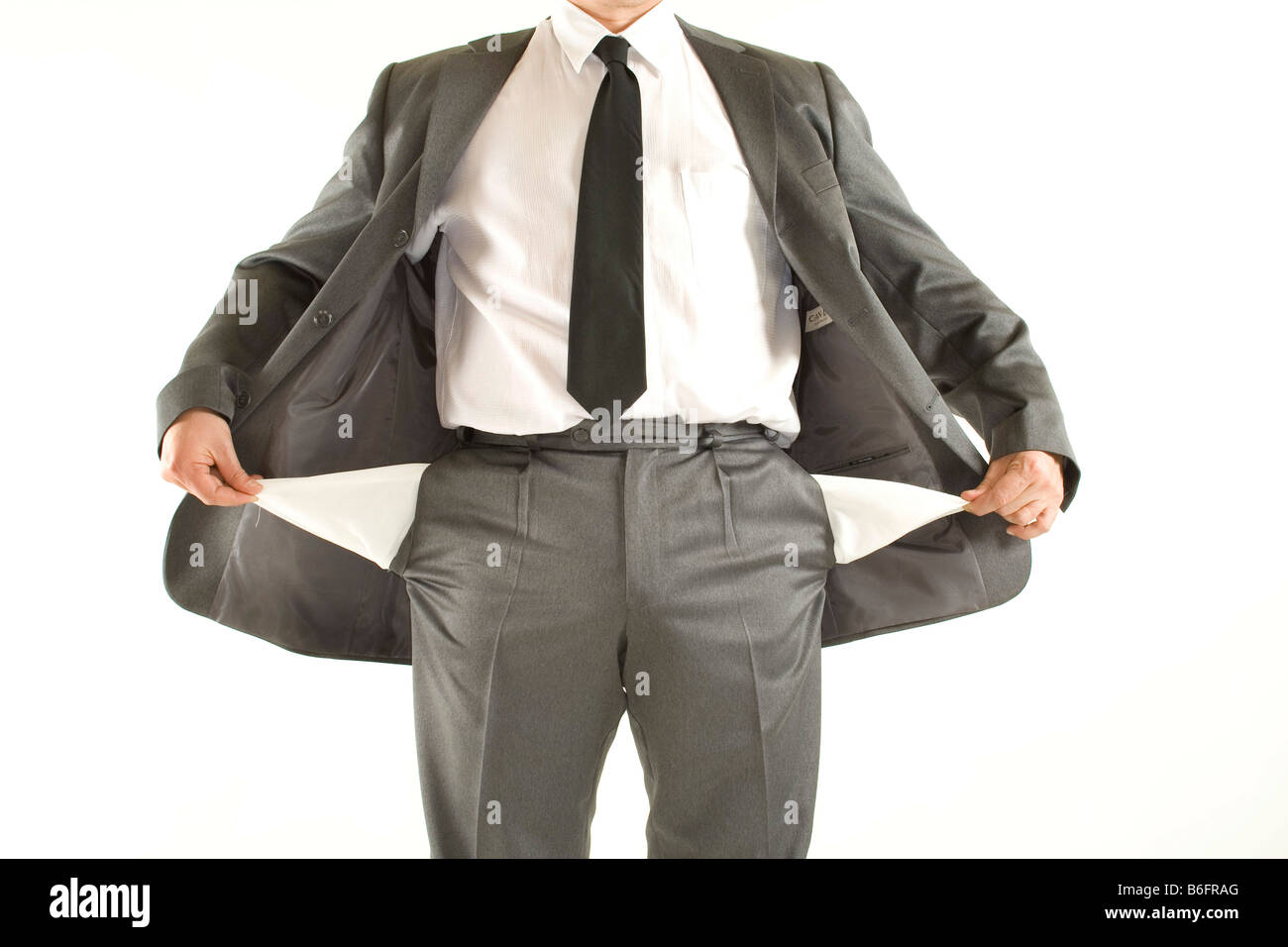 Bankrupt businessman turning out his empty pockets Stock Photo