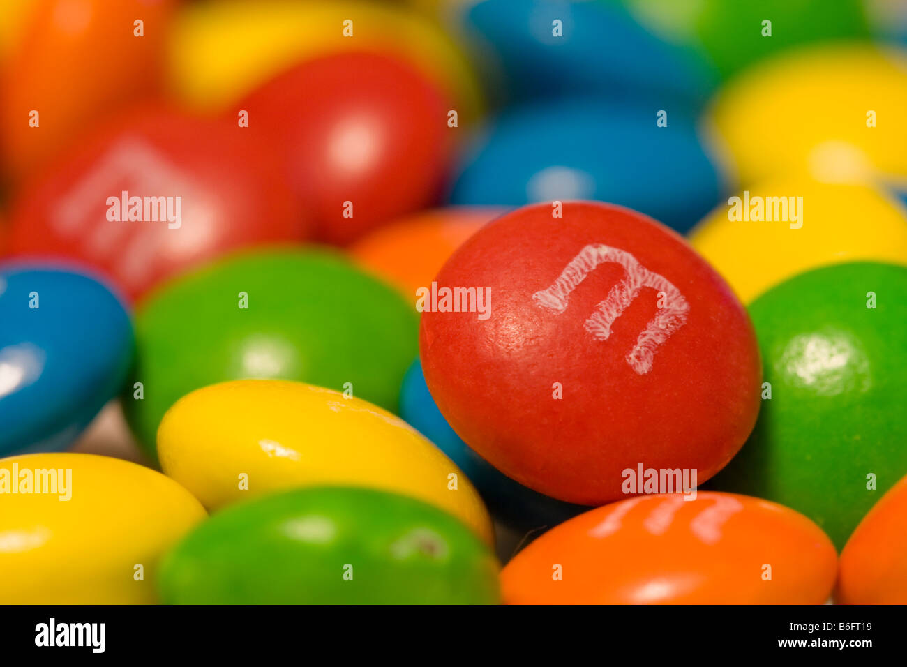Florence, Italy - 2020, Jan 19: Red M&M character holds a candy container  on his head. White background. Clipping path Stock Photo - Alamy
