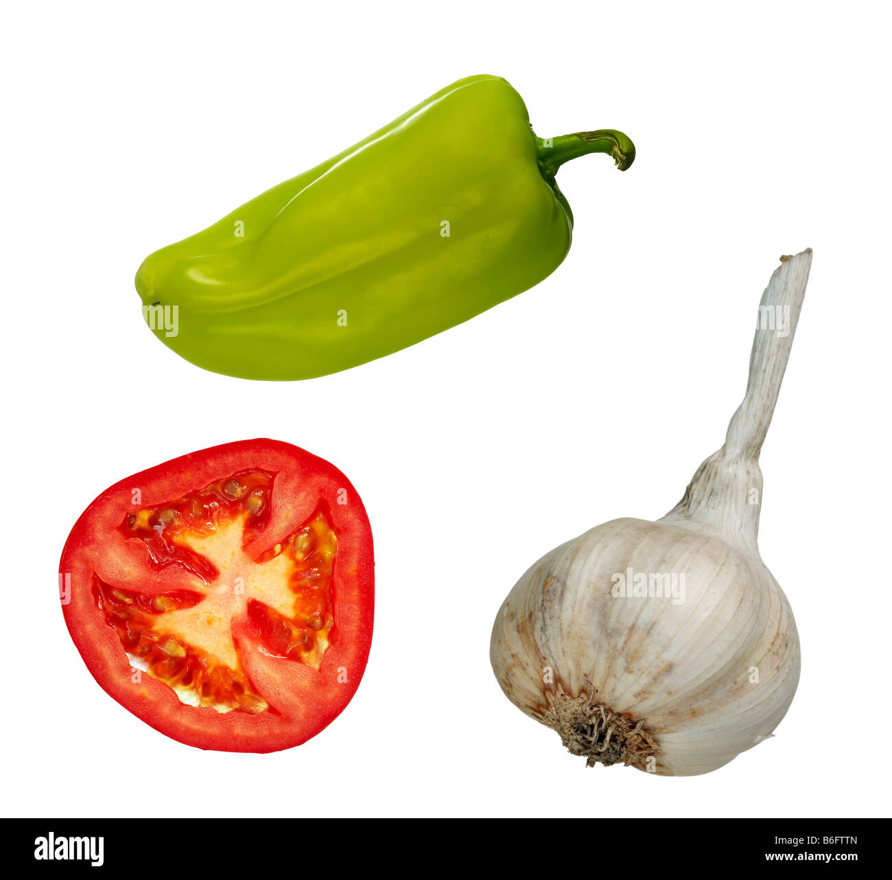 Detail of the vegetables - slice of tomato, garlic and green pepper - isolated Stock Photo