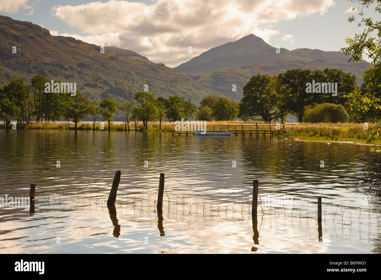 Boat on Loch Lomond Scotland with Ben Lomond in the background Stock Photo