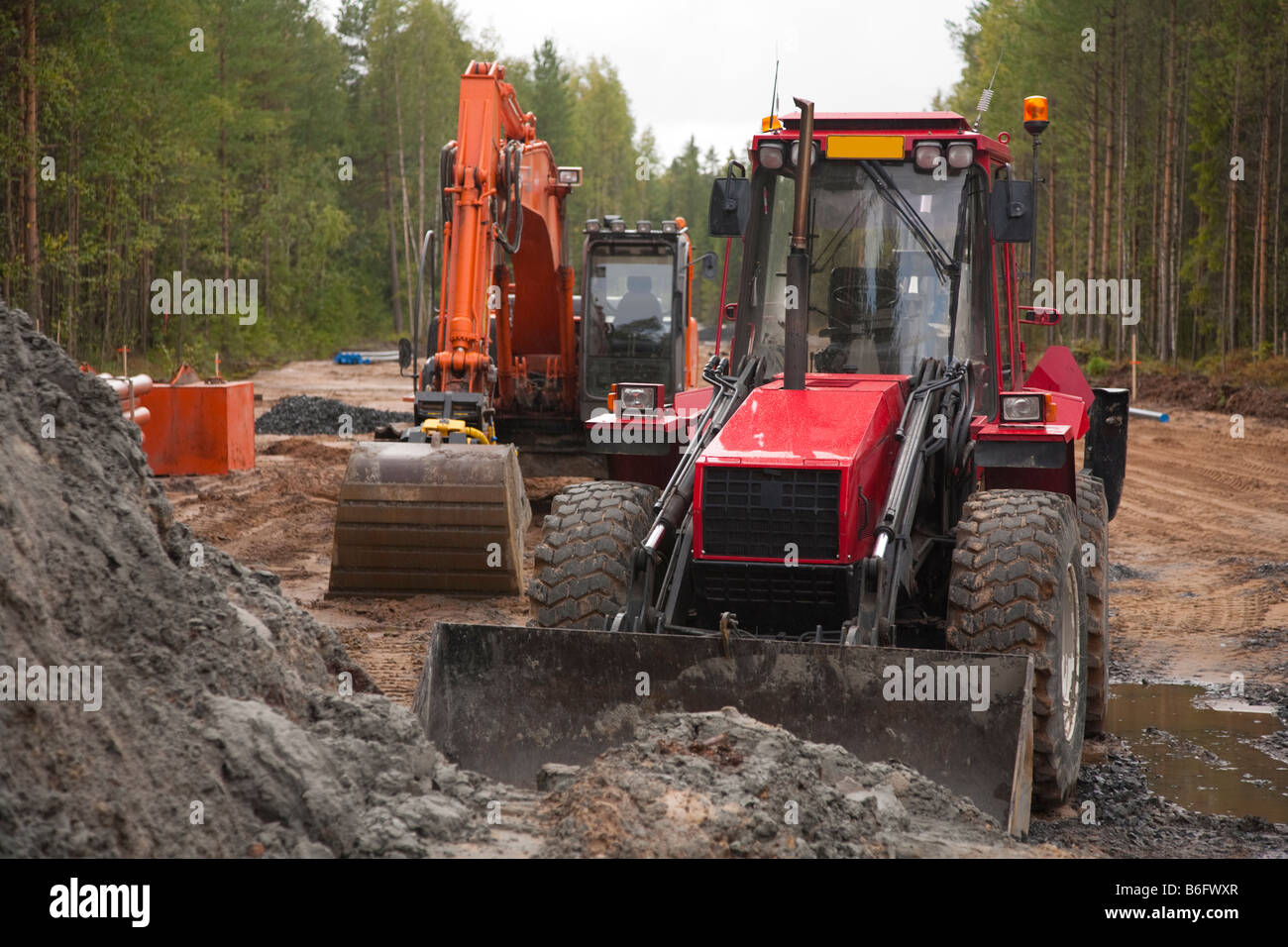 Tractor and digger in roadworks site , Finland Stock Photo Alamy