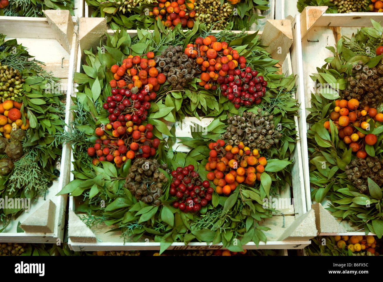 UK Cheshire Chester Eastgate Street Christmas Street traders stall selling xmas wreaths Stock Photo