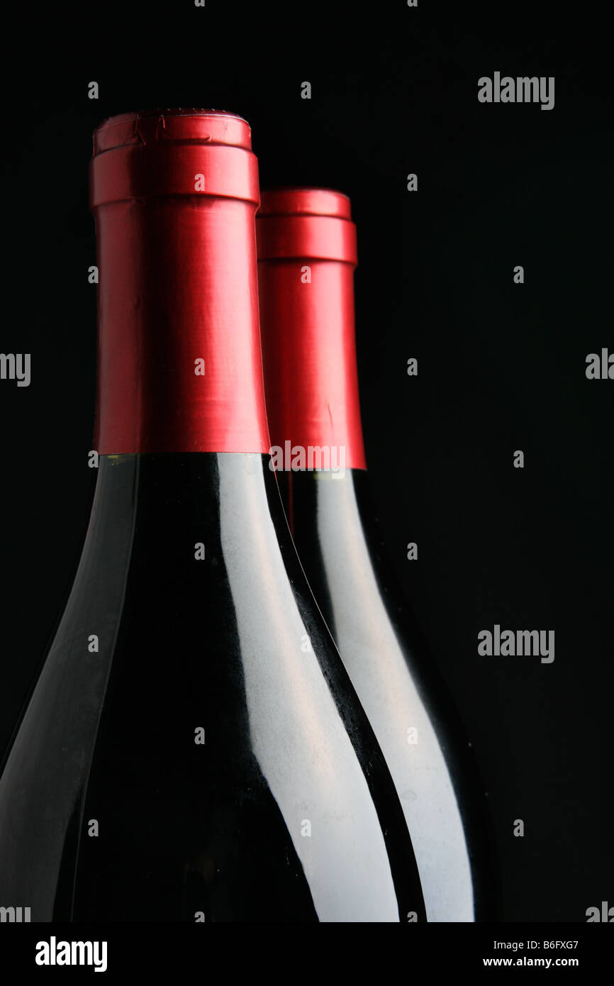 Two corked wine bottles over black background Stock Photo Alamy