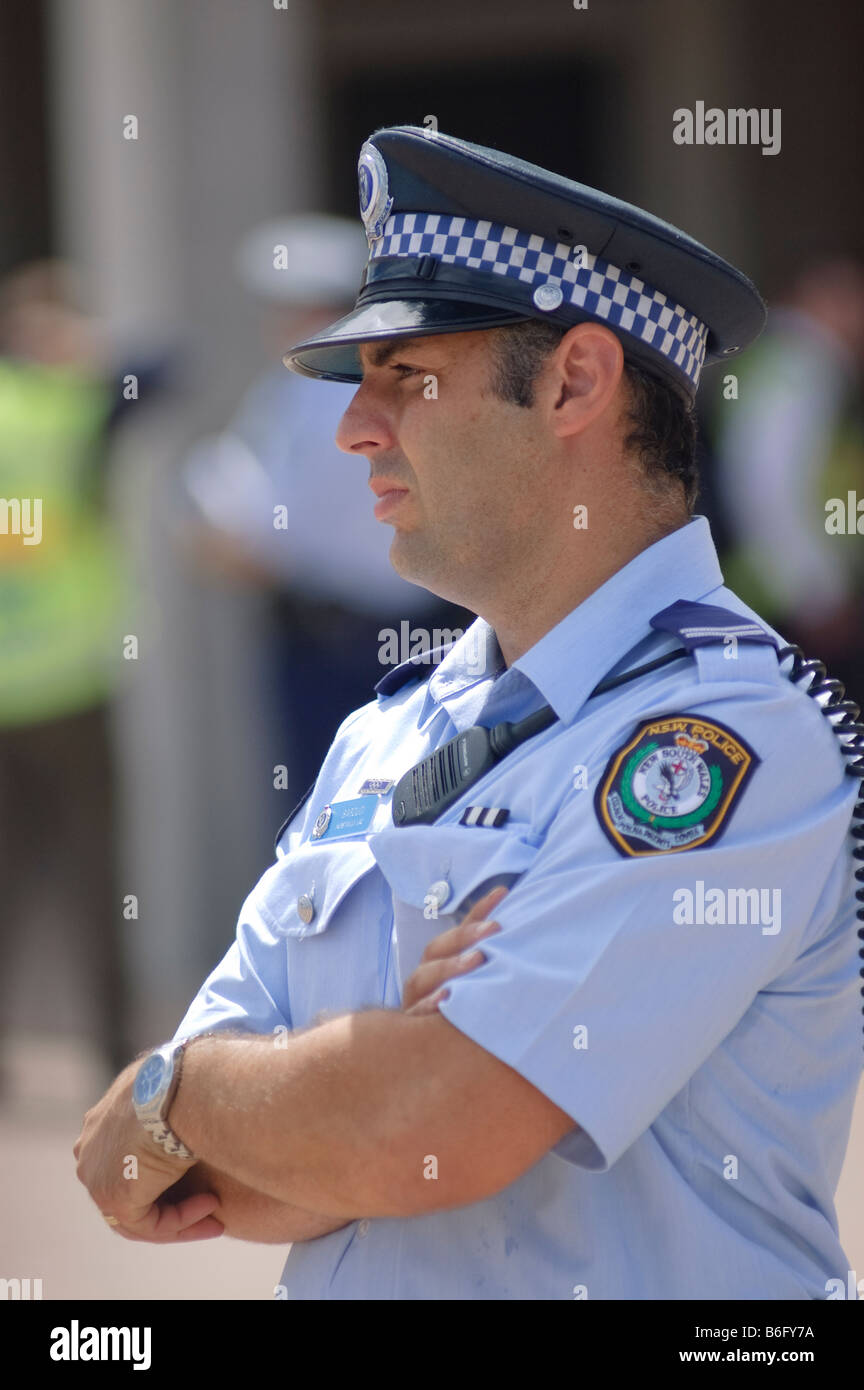 Policeman watches the crowds on crowd control duty Stock Photo