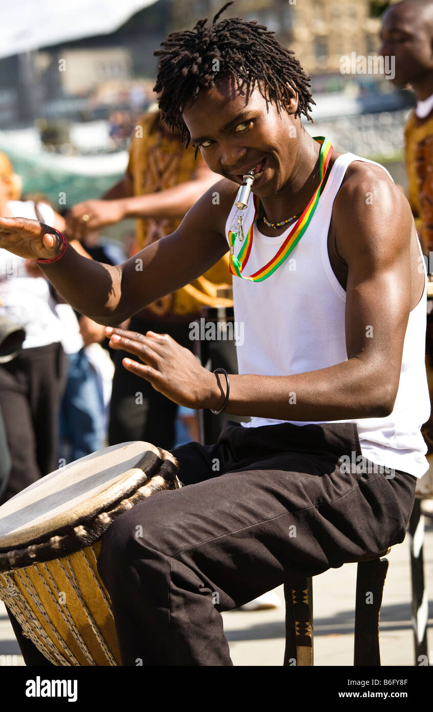 Member of Siyaya Arts music group from Africa playing in Princes Street during the Edinburgh fringe festival Scotland Stock Photo