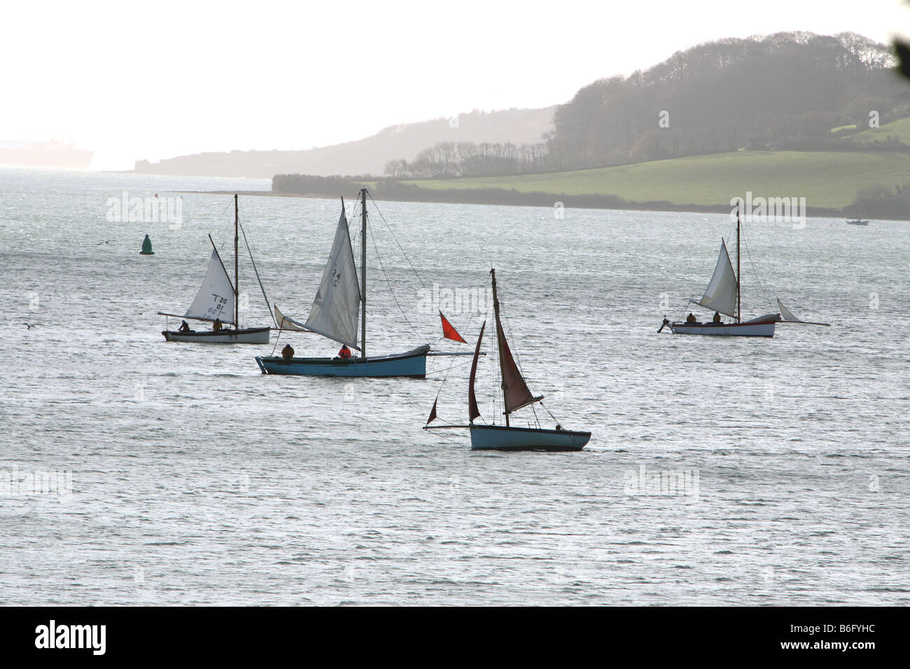 Oyster fishermen in Falmouth working boats sailing on the Carrick Roads Cornwall in Winter Stock Photo