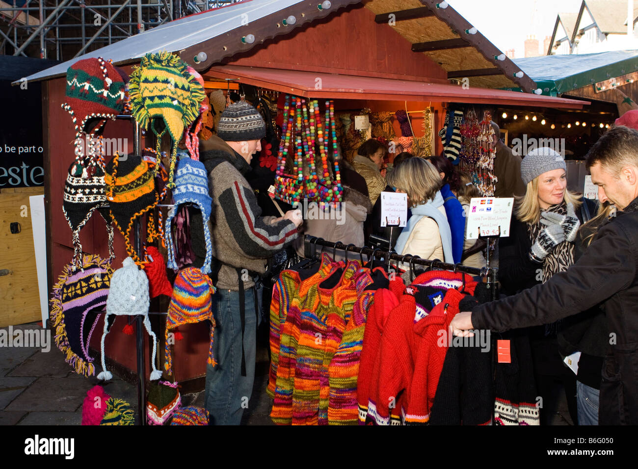 UK Cheshire Chester Continental Christmas market warm knitted clothing stall Stock Photo
