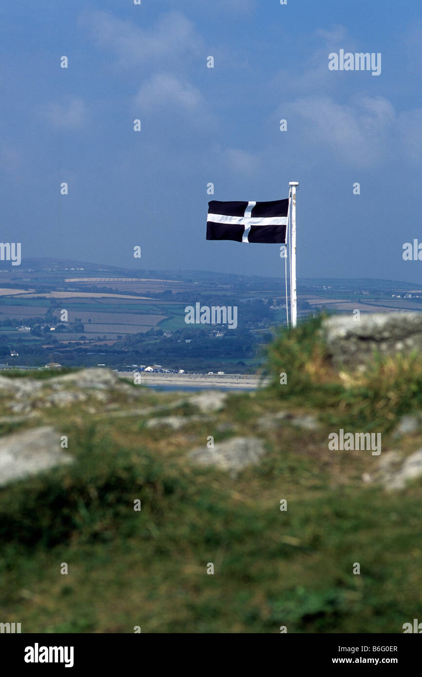 Cornish flag flying over Cornish countryside Stock Photo