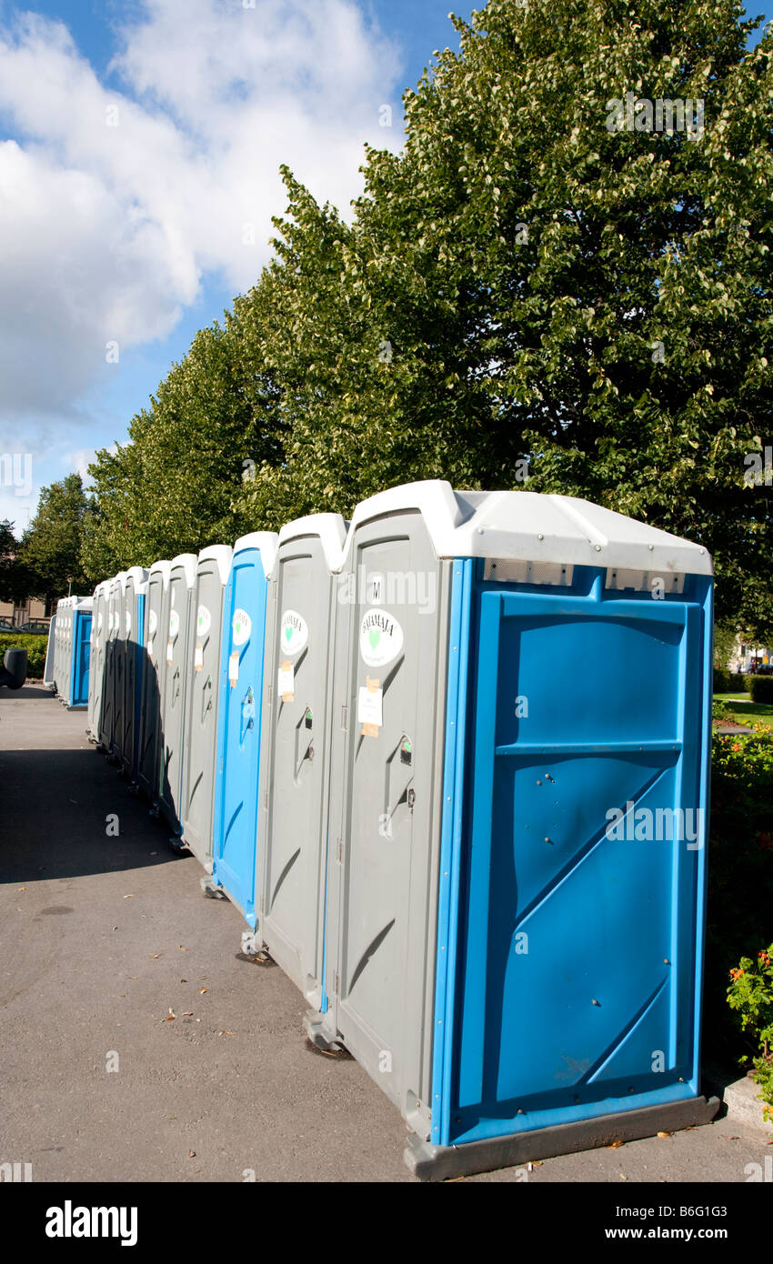 Row of movable outhouses , Finland Stock Photo