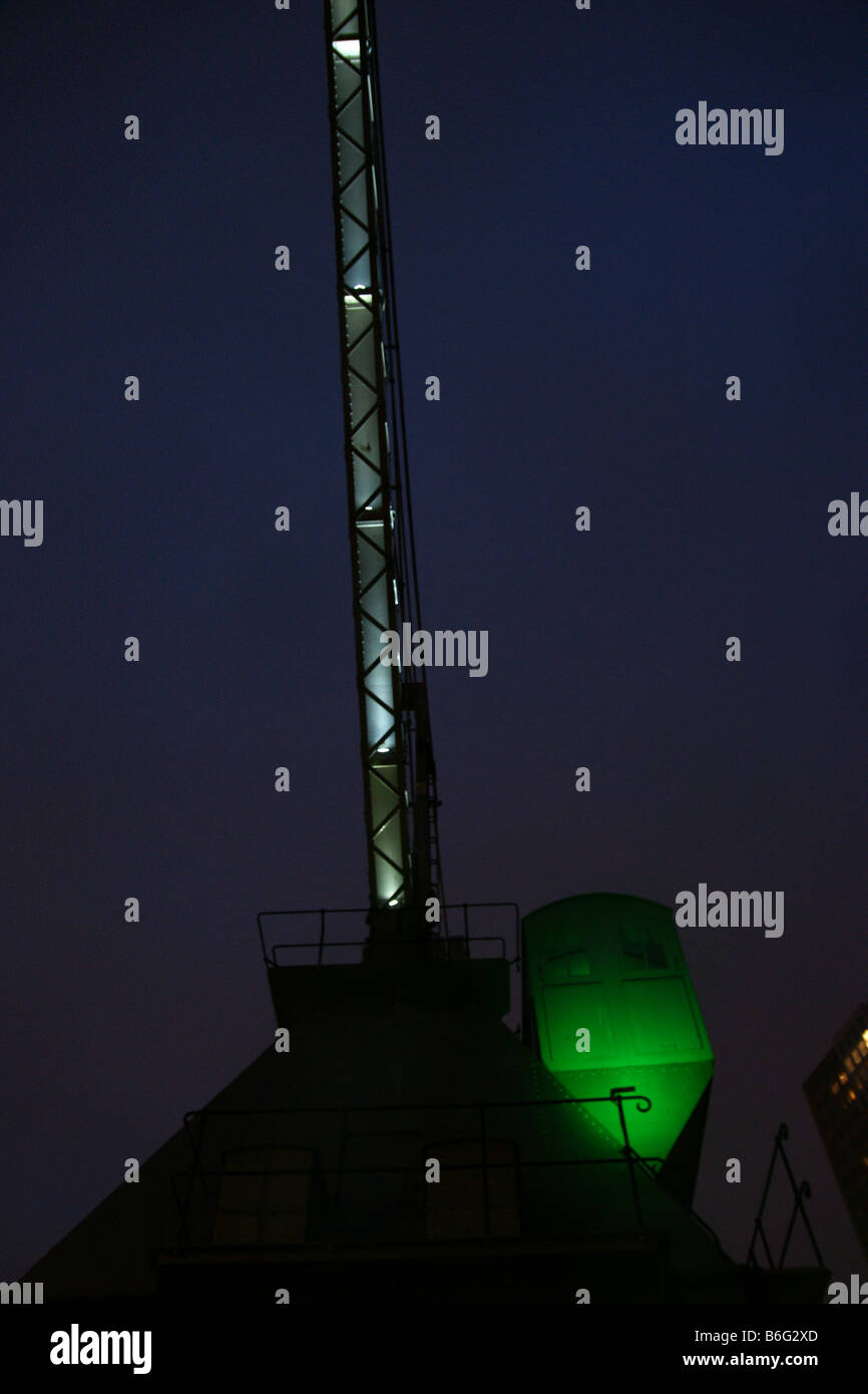 Green crane marine machine museum Maritime Maritiem night dark sky Rotterdam Netherlands shipping industry inustrial Stock Photo