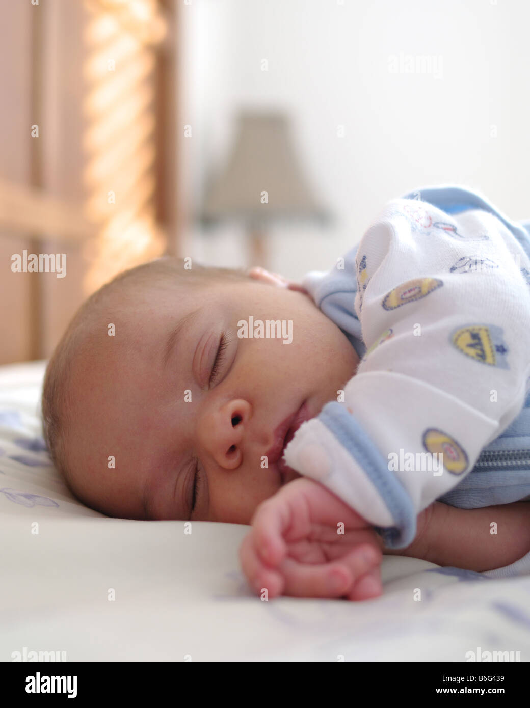 2 months old baby boy sleeping in parents bed Stock Photo Alamy