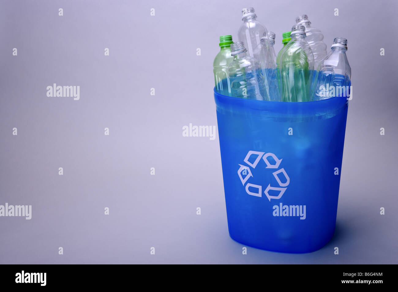 Empty plastic bottles in a blue recycling bin Stock Photo Alamy