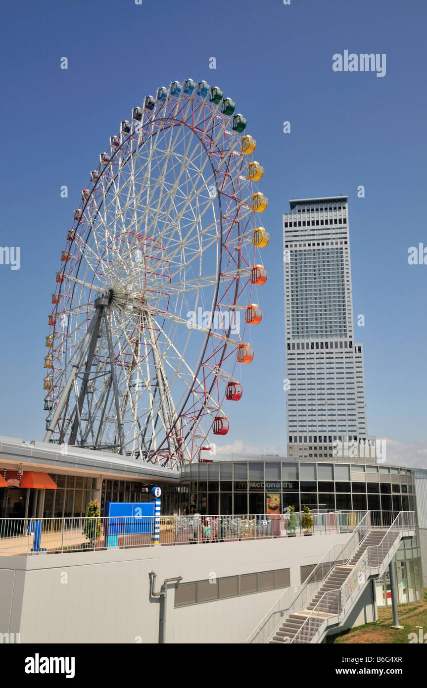 Seacle Rinku Pleasure Town Outlet Mall with ferris wheel with coloured capsules and Ana Tower Gate Hotel, Osaka, Japan Stock Photo