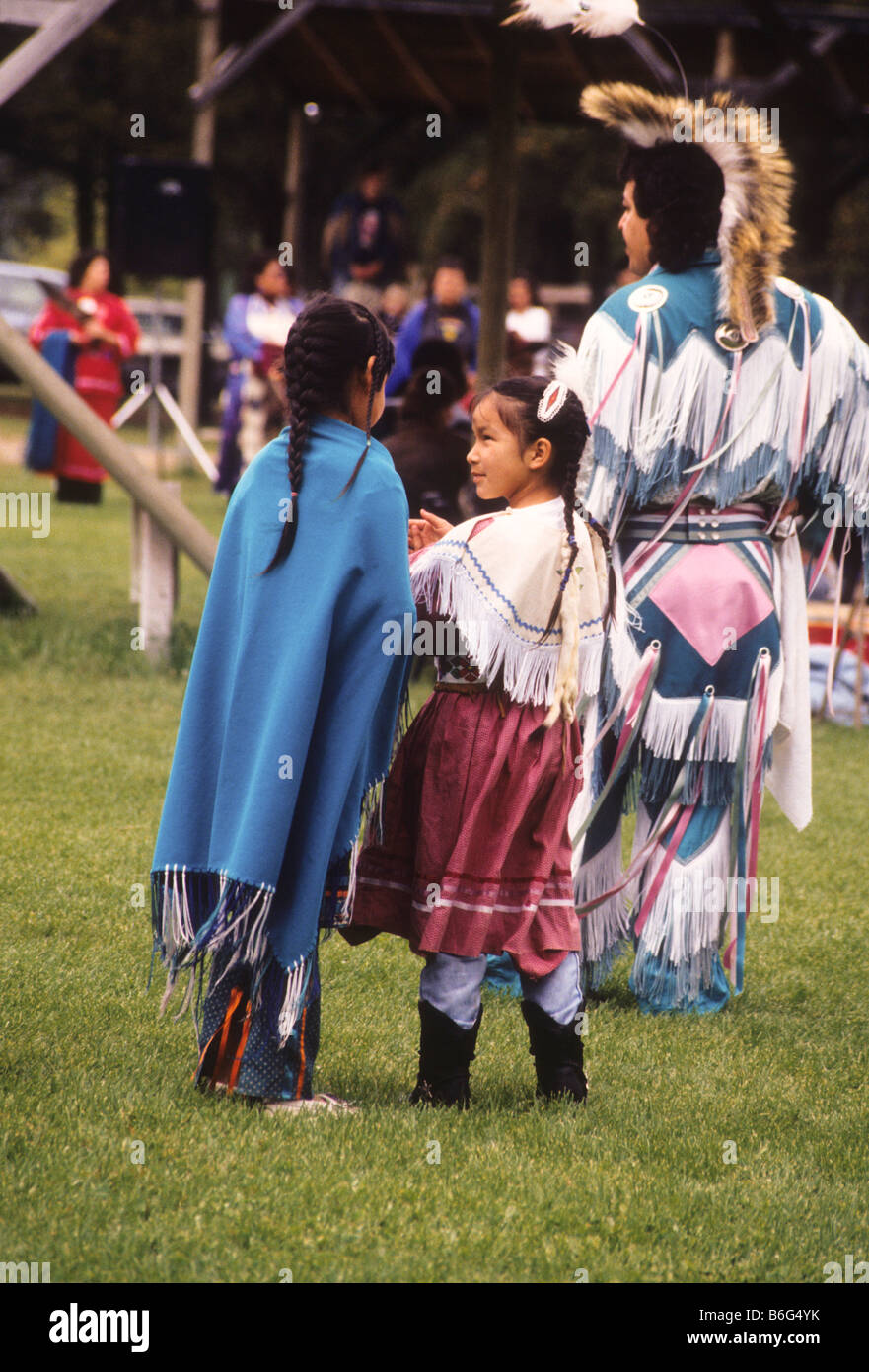 Native American Indians celebrate and dance at powwow. Stock Photo