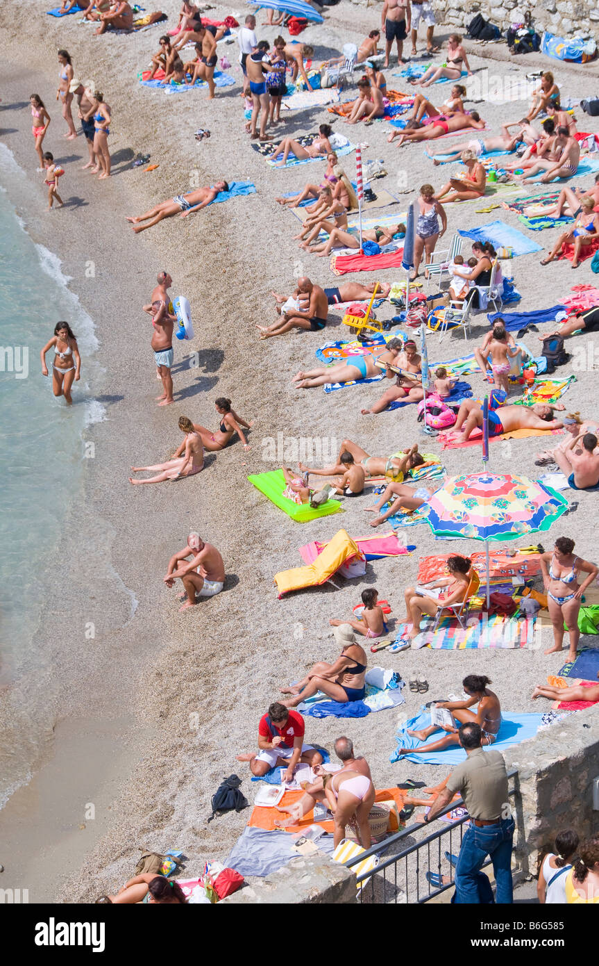 Sunbathers on the beach Stock Photo