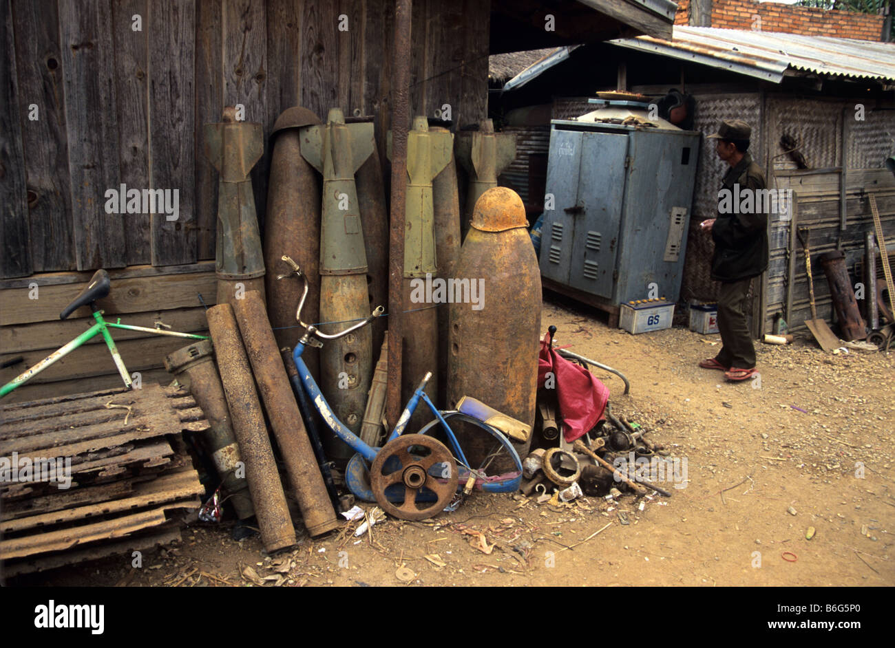Scrap metal dealer and yard with US Vietnam war-era war scrap, cluster bomb casings, missiles and mortars, Phonsavan, Laos Stock Photo